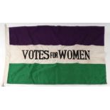 A Votes For Women Suffragette flag with printed maker's mark 'W.S.P.U.' 93 by 61cms. Condition