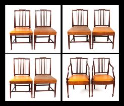 A set of eight 19th century mahogany dining chairs with carved back rail, over-stuffed leather