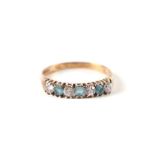 A 9ct gold dress ring set with pale blue and white stones, approx UK size N, 1.6g.