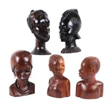 A group of African carved hardwood busts, the largest 22cms high (7).