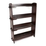 An Arts & Crafts style oak open four-tier bookcase, 88cms wide.