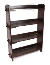 An Arts & Crafts style oak open four-tier bookcase, 88cms wide.