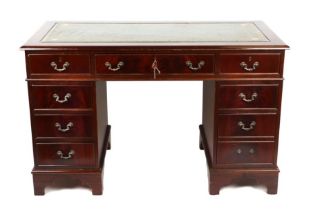 A George III style mahogany veneered pedestal desk with leather inset top and three drawers on