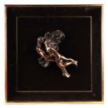 Giovanni Schoeman (South African 1940-1981) - A bronze resin relief sculpture depicting a kissing