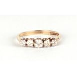 A 9ct gold ring set with five graduated white stones, approx UK size N, 2g.