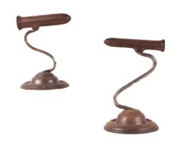 A pair of Victorian goffering irons on circular bases, 15cms high (2).