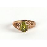 A 9ct gold dress ring set with a large pale green stone approx UK size K, 1.7g.