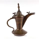 A Turkish / Islamic brass dallah coffee pot, 26cms high.