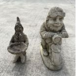 A weathered concrete figure of a gnome riding a motorcycle,58cms high; together with a similar