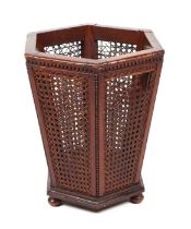 A Regency style waste paper basket of hexagonal form with cane work panels, 36cms wide.