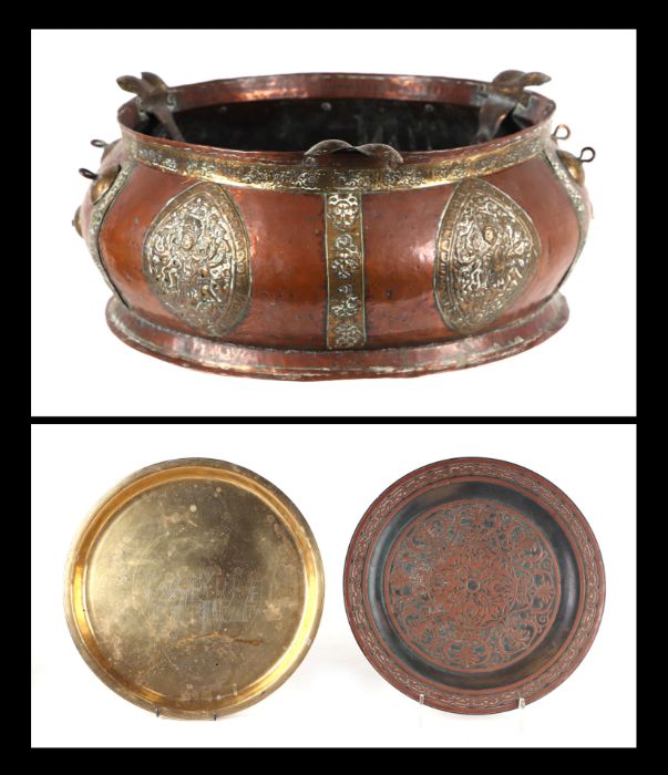 A large Tibetan copper and brass bowl, 44cms diameter; together with a Chinese brass tray and a