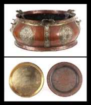 A large Tibetan copper and brass bowl, 44cms diameter; together with a Chinese brass tray and a