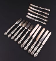 A quantity of silver handled desert knives and forks.