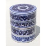 An 18th century Chinese blue & white sectional stacking box of cylindrical form, 12cms high.