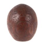 A coconut shell carved Jamaica, palm trees and other leaves, 12cms high. Condition Report The nut