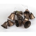 A group of bronze / gun metal graduated bells, the largest 12cms high (11).
