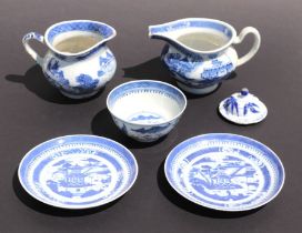 A pair of Chinese blue & white shallow dishes decorated with a pagoda, 15cms diameter; together with