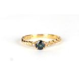 An 18ct gold diamond and sapphire ring, approx UK size P, 3g.