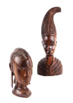 A pair of African hardwood bust depicting a man and a woman. largest 32cm high