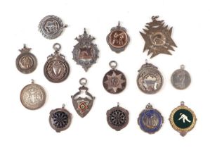 A group of silver pocket watch fobs and medallions, various dates and maker's marks, 154g.