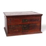 A haberdasher's stained wooden two-drawer chest containing a large amount of sewing related items,