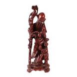 A Chinese rootwood carving depicting Shoulau, 31cms high.