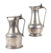 Two early 19th century pewter flagons, one inscribed on the handle 'M Dudouit', 30cms high and 27cms