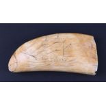 A 19th century whale tooth scrimshaw, one side carved with a ship in full sail, the reverse with a
