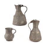 Two Islamic Berber tinned copper coffee pots; together with a similar tankard, the largest 28cms