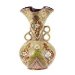 A continental pottery two-handled vase decorated with flowers, 32cms high. Condition Report One