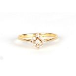An 18ct gold diamond cluster ring, approx UK size S, 2.1g.