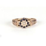 A 9ct gold diamond and sapphire cluster ring, approx UK size M, 1.8g.