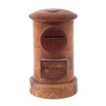 A treen moneybox in the form of a postbox, 15cms high.