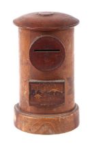 A treen moneybox in the form of a postbox, 15cms high.