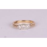 A 9ct gold three-stone diamond ring, approx UK size N, 3.3g.