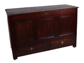 A 17th century oak mule chest with three panelled front above two drawers, on stile feet, 125cms