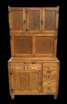 A 1950's oak and ash kitchen cupboard, the superstructure with three cupboards and enamel lined