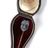 A yellow metal mounted labradorite stick pin carved as a devil's head with inset rose cut diamond