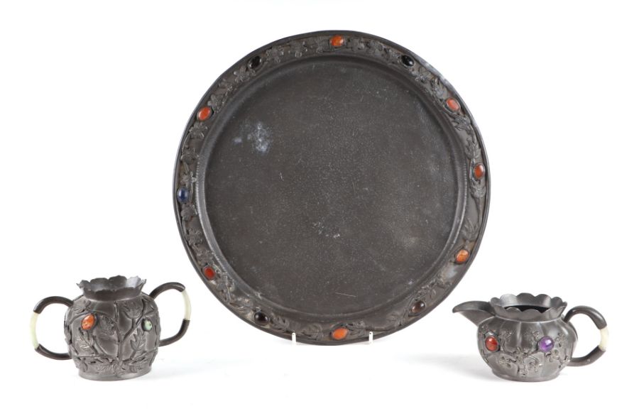 A Chinese pewter sugar bowl and milk jug on matching circular tray, with applied cabochon - Image 2 of 2