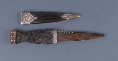 A silver mounted Sgian Dubh, Edinburgh 1967 and maker's mark for Thomas Kerr Ebbutt, 20cms long.