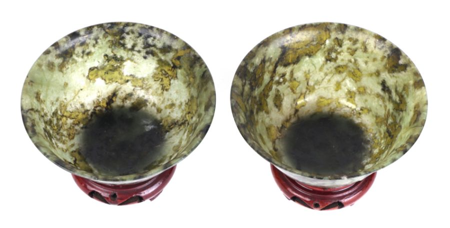 A pair of Chinese spinach jade bowls on stands, 10cms diameter. Condition Report One bowl has been - Image 2 of 2