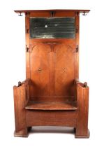 An early 20th century oak hall stand with box seat, 120cms wide.