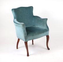 An Edwardian upholstered tub armchair.