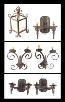 A pair of wrought iron twin-arm wall lights, 34cms wide, three Gothic style wrought twin-arm wall