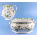A Victorian green & white footbath and water jug decorated with flowers, the footbath 47cms wide,