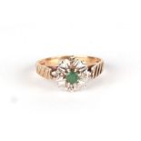 A 9ct gold diamond and emerald cluster ring, approx UK size M, 2.6g.