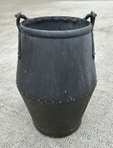 A large riveted well bucket, 65cms high.