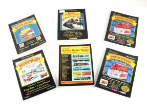 A group of Diecast and model train price guide reference books.