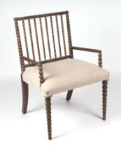 A Julian Chichester bobbin turned elbow chair with upholstered seat. Condition Report Generally good