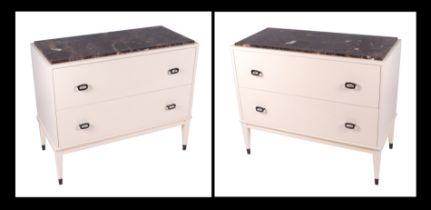 A pair of Fiona McDonald Carla cabinets with figured brown marble tops above two long drawers, on